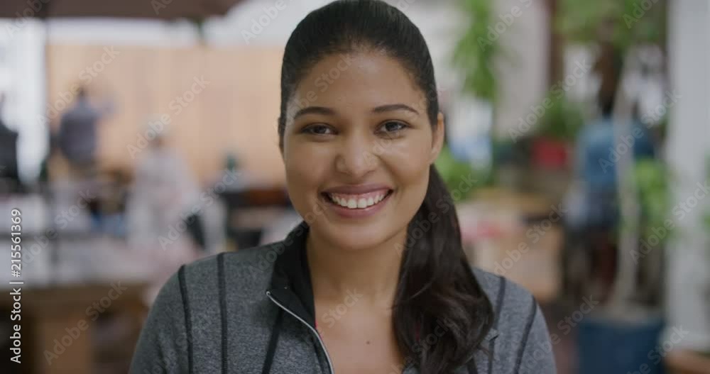 close up portrait of beautiful mixed race woman smiling happy looking at camera enjoying successful urban city lifestyle outdoors restaurant background close up portrait of beautiful mixed race woman smiling happy looking at camera enjoying successful urban city lifestyle outdoors restaurant background