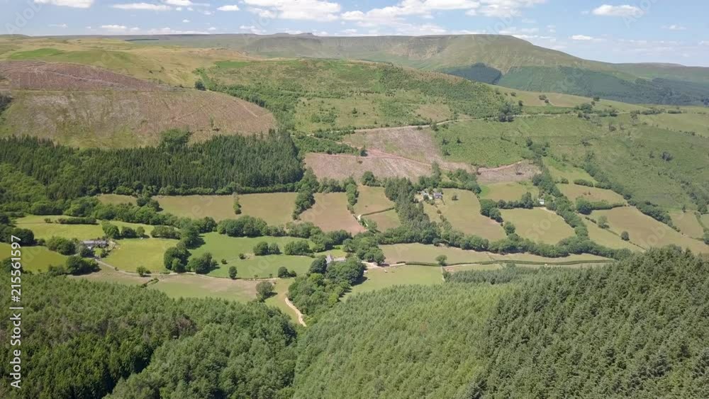 Aerial drone view of lush, green farmland and hills in the Brecon Beacons, Wales Aerial drone view of lush, green farmland and hills in the Brecon Beacons, Wales