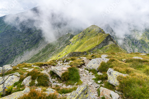 Misty mountains and hiking trail © Xalanx