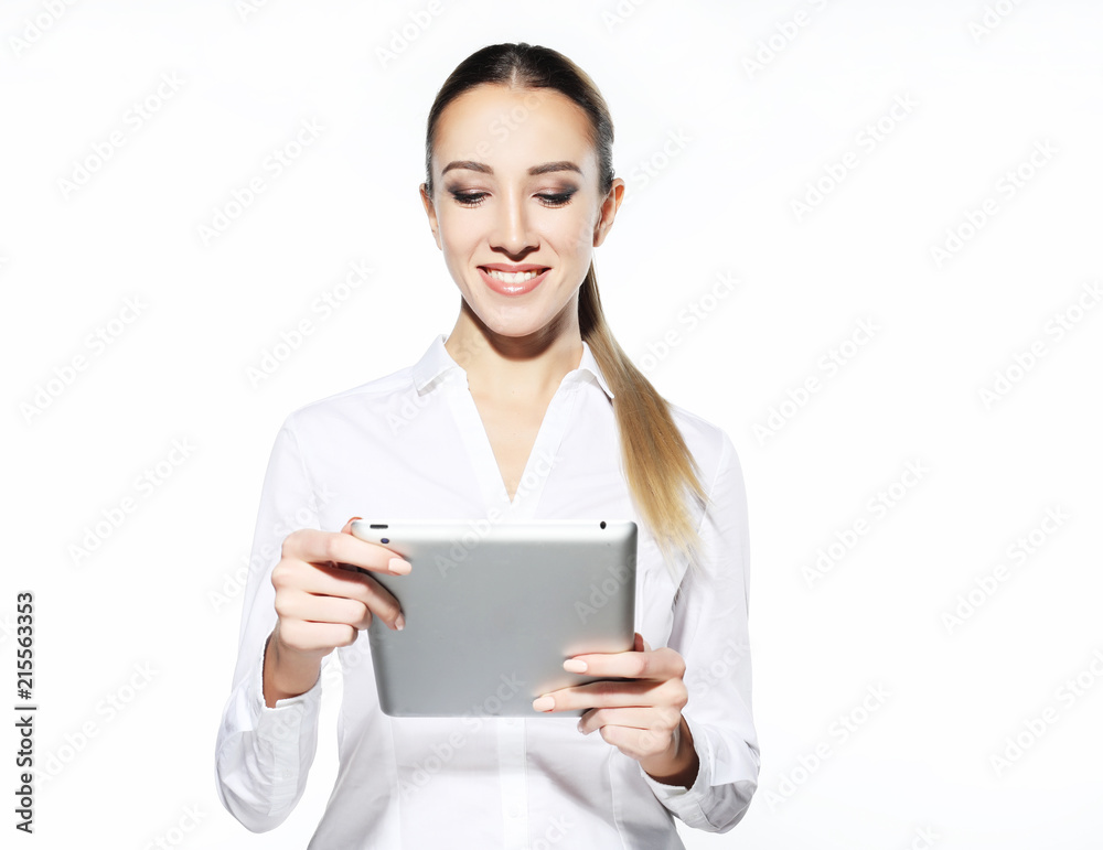 Woman holding tablet computer isolated on white background. working on touching screen. Casual smiling caucasian woman. Woman holding tablet computer isolated on white background. working on touching screen. Casual smiling caucasian woman.