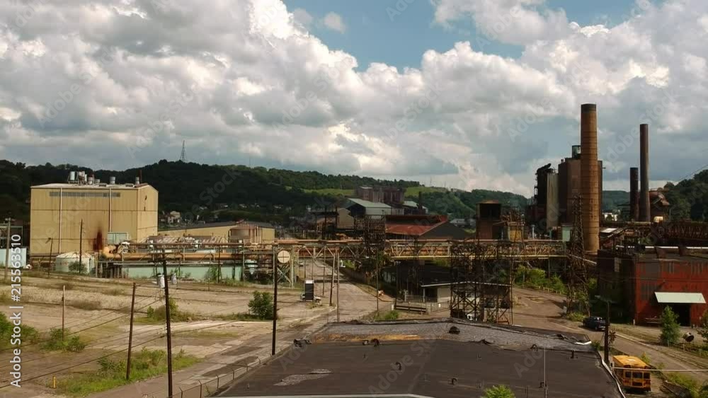 A descending drone shot of an industrial area. A descending drone shot of an industrial area.