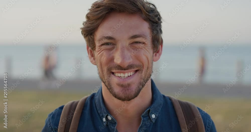 portrait handsome successful man laughing happy enjoying leisure lifestyle caucasian male on vacation slow motion