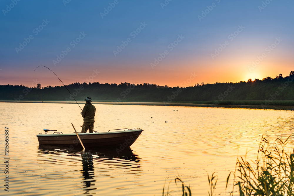 man fishes in the lakes of the Mazury man fishes in the lakes of the Mazury