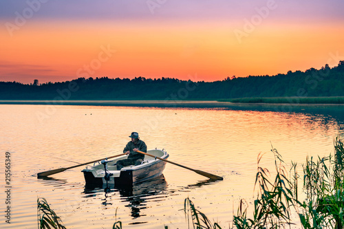 man fishes in the lakes of the Mazury