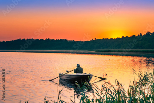 man fishes in the lakes of the Mazury