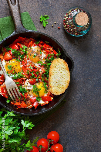 Shakshuka is a traditional breakfast of Israeli cuisine. Eggs fried in tomato sauce with pepper, onions and spices.