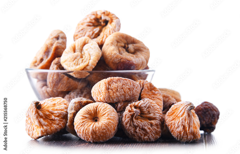 Composition with bowl of dried figs isolated on white Composition with bowl of dried figs isolated on white