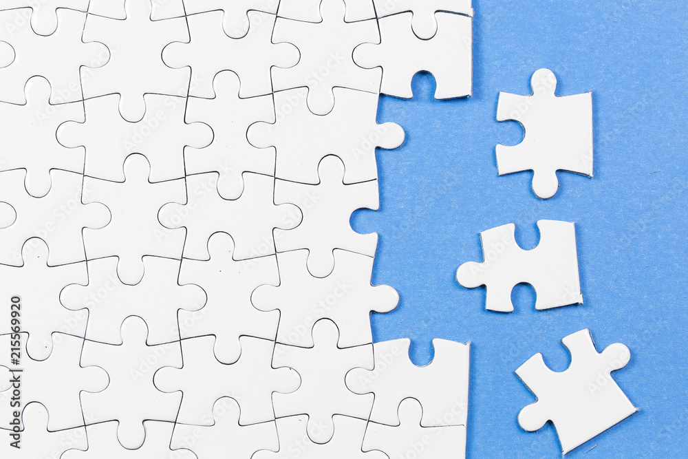 Blue background made from white puzzle pieces and place for your content Blue background made from white puzzle pieces and place for your content