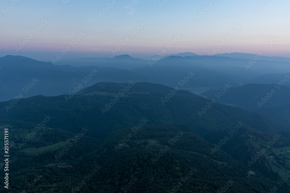 Mountain range panorama, scene tinted in blue due to evening time at Catalonia, Spain