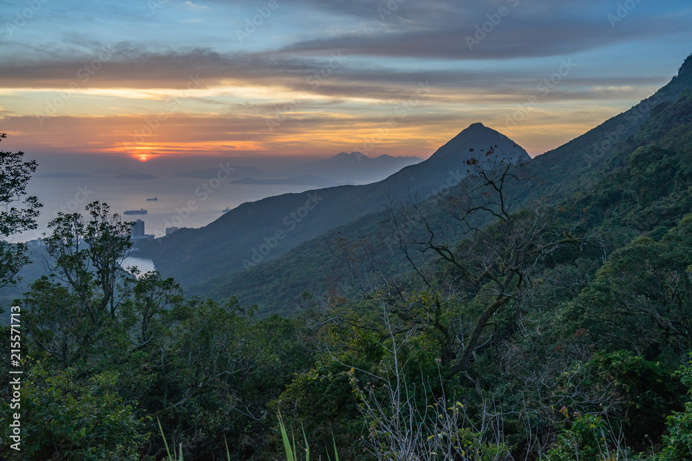 Scenic sunset from Hong Kong Victoria Peak, with South China Sea on the background