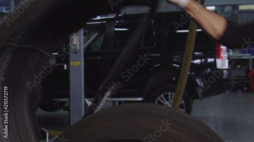Wallpaper Mural Balancing wheels in a service. Tire repair perform balancing wheels in a service Torontodigital.ca