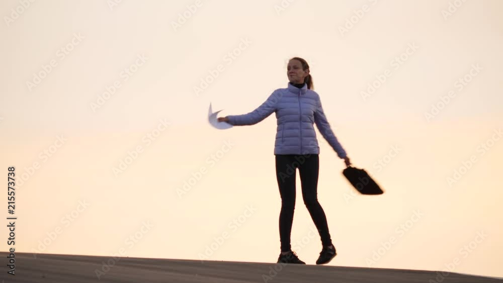 Happy woman dancing with documents Happy woman dancing with documents