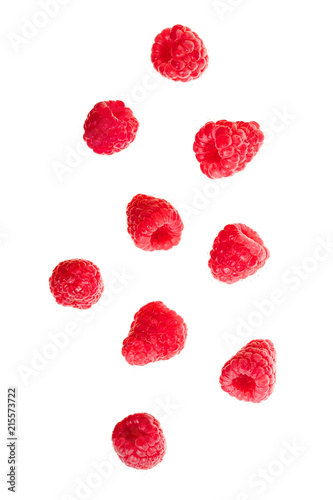 falling red raspberries isolated on white background