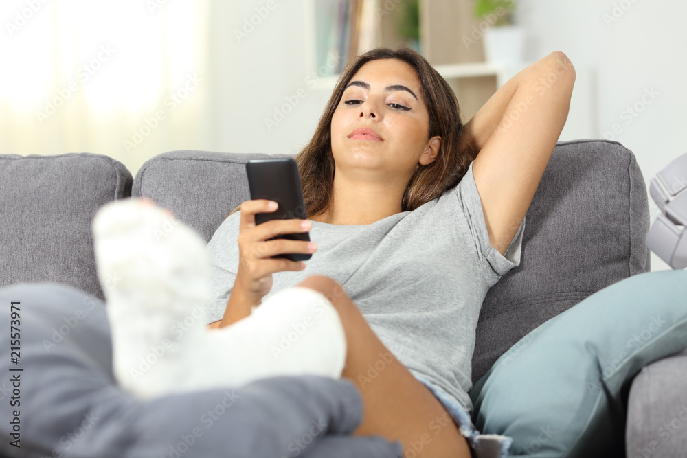 Serious disabled woman using a smart phone Serious disabled woman using a smart phone
