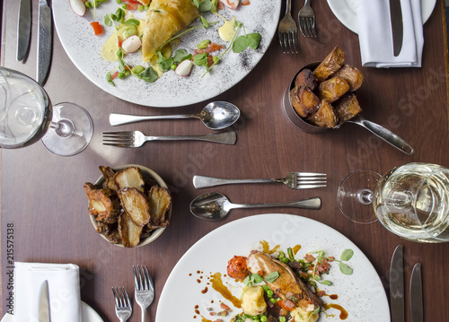 Restaurant Table Layout with Salmon and Chicken Dish photo