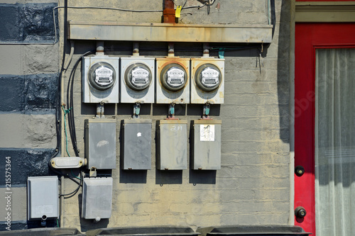 Isolated old electric meters outside building