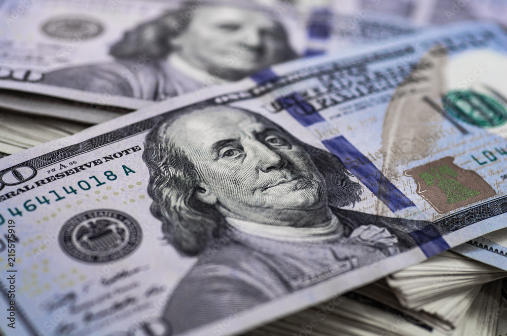 Macro shot of a 100 dollar. Dollars Closeup Concept. American Dollars Cash Money. Hundred Bucks. Benjamin Franklin's portrait.