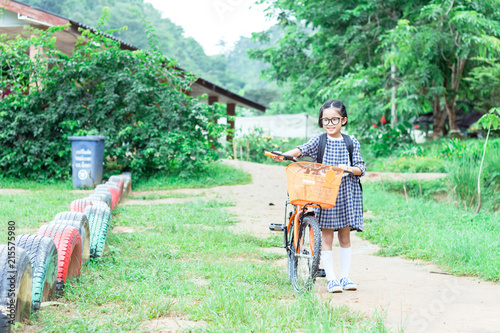 cute little girl riding bike go to school © AungMyo