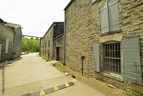 Vintage stone rickhouse holding barrels of bourbon photo