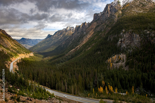 Washington Pass Along the North Cascades Highway During the Autumn Season. Larch trees and snow on the hills signal the approach of winter in the North Cascade Mountain range. © LoweStock