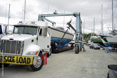 Loading large sailboat on a flat bed truck