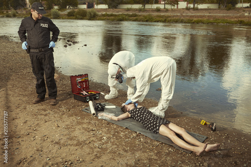 Woman body in black apparel found drowned near summer river bank in city