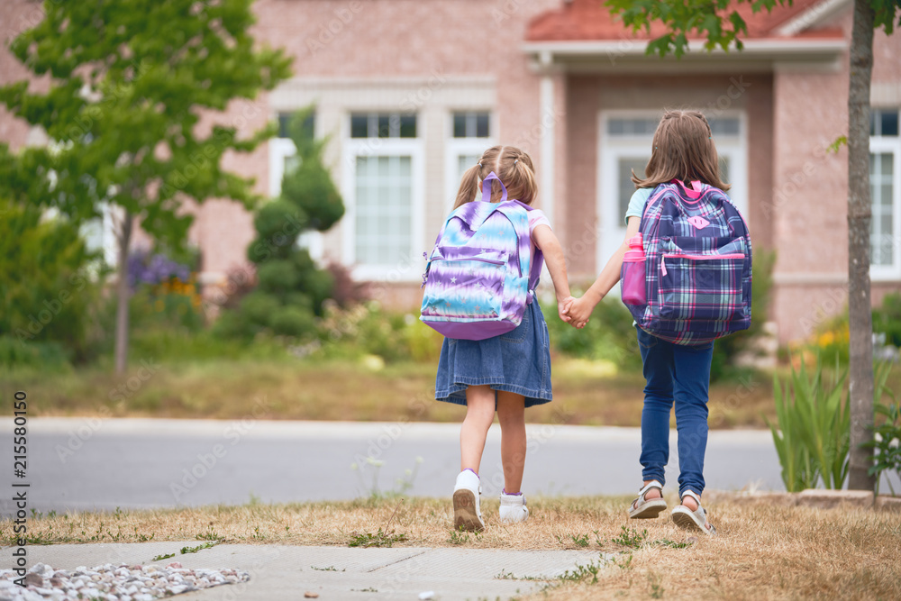 Girls with backpack is going to school Girls with backpack is going to school