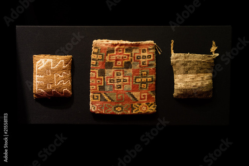 Pre-Incan bag and accessories woven in cotton on a black background