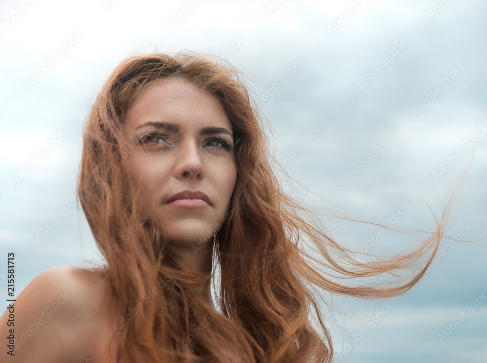 beautiful sharmed girl looking at the ocean in the summer beach. Smiling young woman on seaside. Happyness and freedom comcept beautiful sharmed girl looking at the ocean in the summer beach. Smiling young woman on seaside. Happyness and freedom comcept