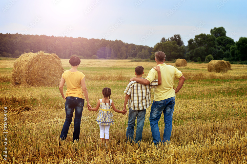 Happy family in wheat field Happy family in wheat field