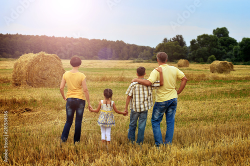 Happy family in wheat field