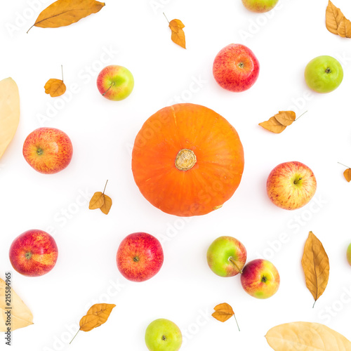 Fototapeta Naklejka Na Ścianę i Meble -  Thanksgiving autumn background with fall dried leaves, apples and pumpkin on white background. Flat lay, top view
