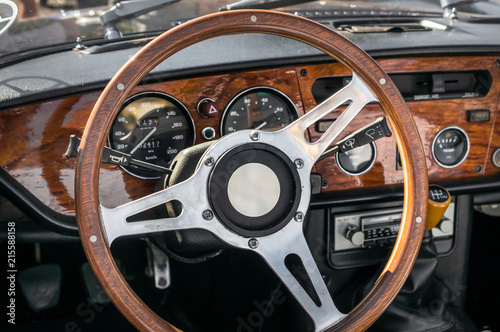 Steering wheel inside old car interior photo