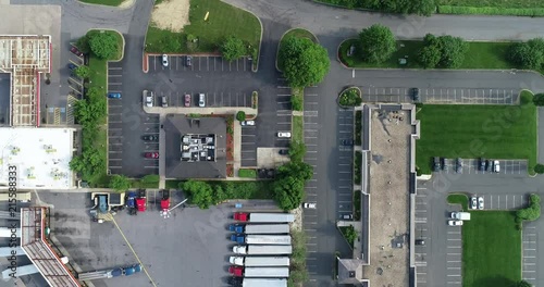 Birds eye view of truck stop near a restaurant parking lot.