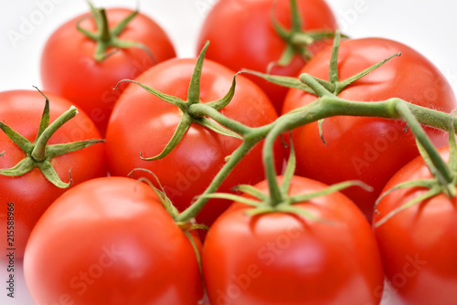 Isolated tomatoes on a white background.