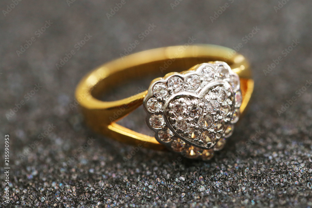 Diamond heart symbol on gold ring Diamond heart symbol on gold ring