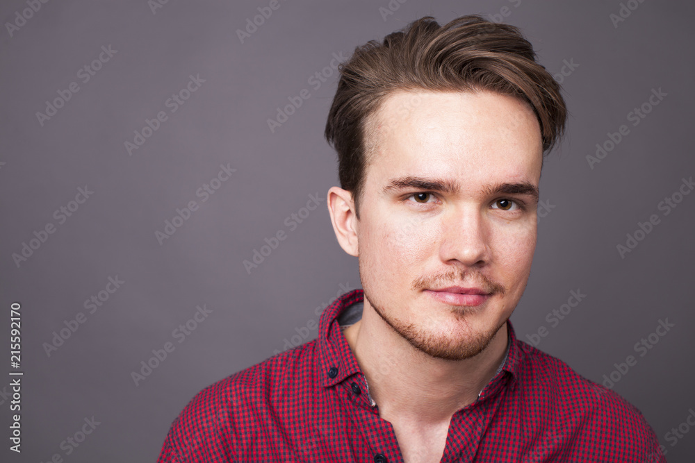Studio portrait of young man on a dark background Studio portrait of young man on a dark background