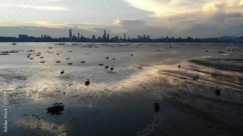 lau fau shan - pak nai mudflat in hong kong with the skyline of shenzhen