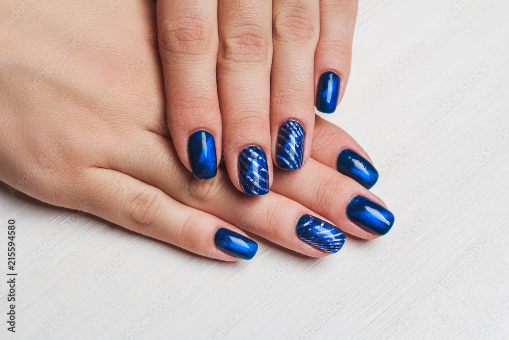 Navy blue nail art Stock Photo | Adobe Stock