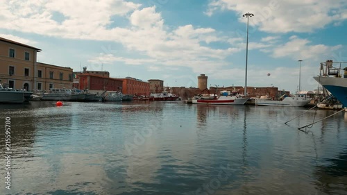 Wide POV shot through the coast of Livorno, Tuscany, Italy featuring the prominent Old Fortress or Fortezza Vecchia, symbol of Medicean Livorno with 3 bastions and 3 main gates photo