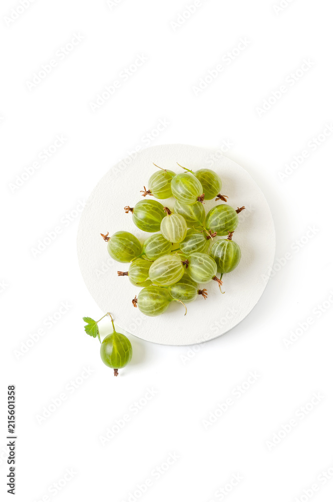 Berries of gooseberry on a pedestal. Isolated on a clean white background.. Berries of gooseberry on a pedestal. Isolated on a clean white background..