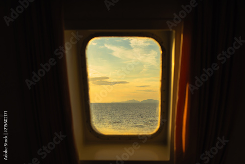 View through the ship window on the Greek islands and the Ionian sea at sunset