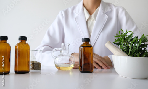 doctor woman scientist making herbal medicine.