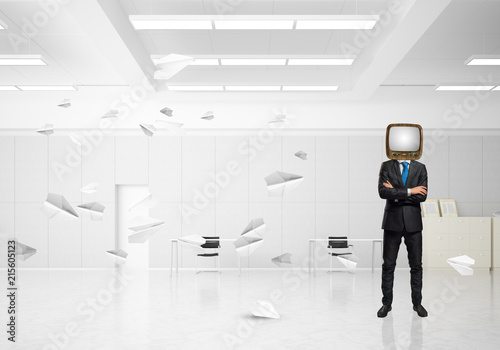 Businessman with an old TV instead of head.