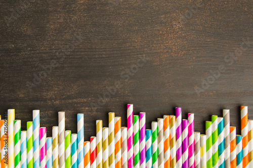 Colorful paper straw in line texture background with copy space photo