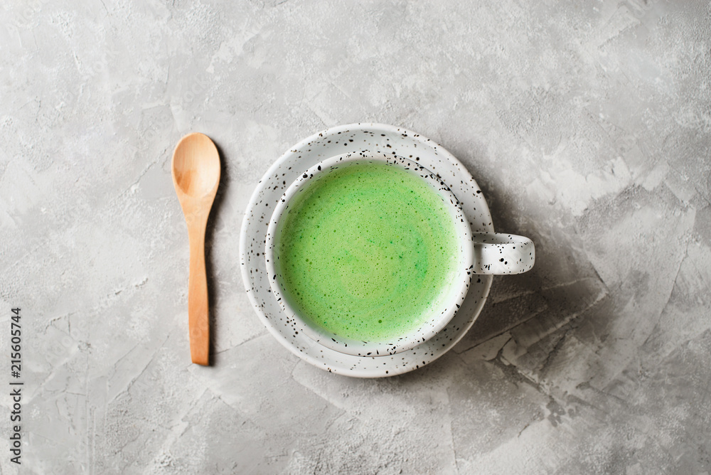 Matcha latte in white cup close up Matcha latte in white cup close up