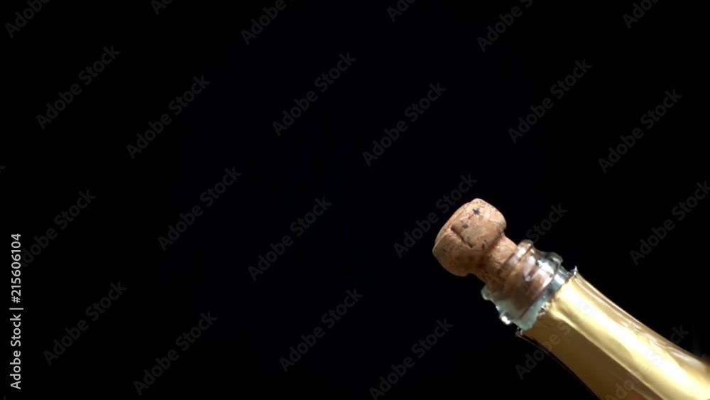 a champagne cork is popping out in slow motion a champagne cork is popping out in slow motion