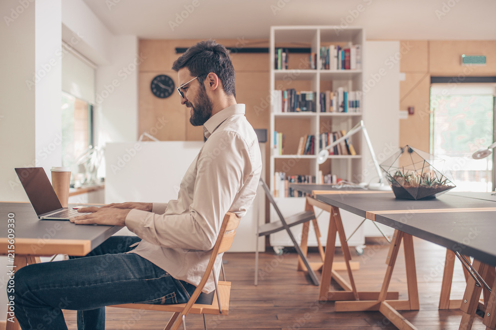 Working young man in coworking Working young man in coworking