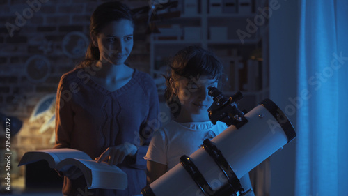 Sisters watching the stars and studying astromony photo