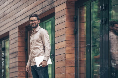 Wallpaper Mural Young man with laptop Torontodigital.ca